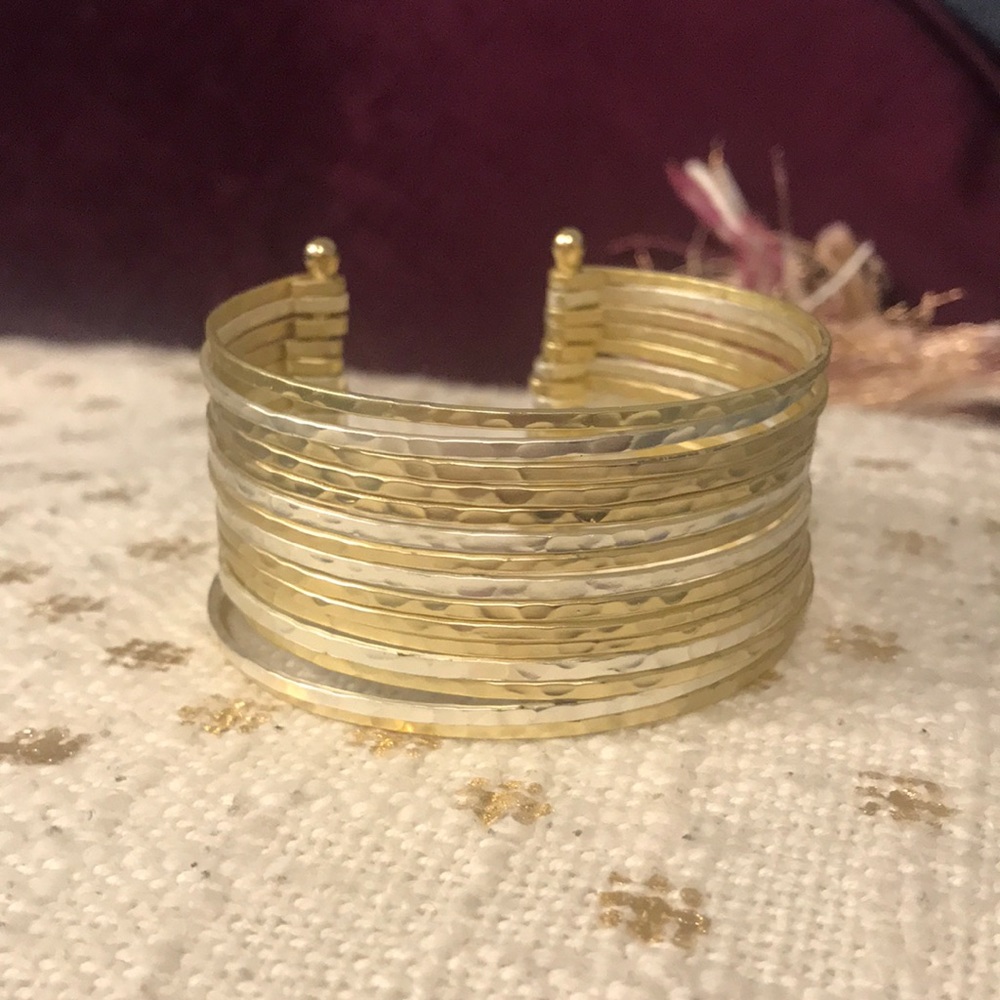 Gold and silver cuff bracelet from Anthropologie.